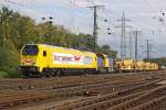 Die Wiebe Maxima 40 CC 264 011-8 mit einen Bauzug in Gremberg am 05,10,10